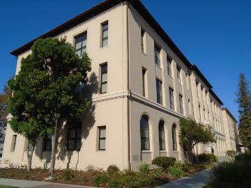 Exterior of a beige academic building named Alumni Science.